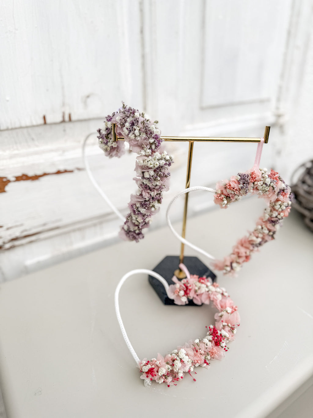 Drei Blumenherzen »Blüten-Herz 1/2« in Rosé und Lila nebeneinander