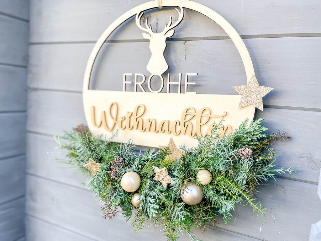 Detailaufnahme Holzloop ‚Frohe Weihnachten‘